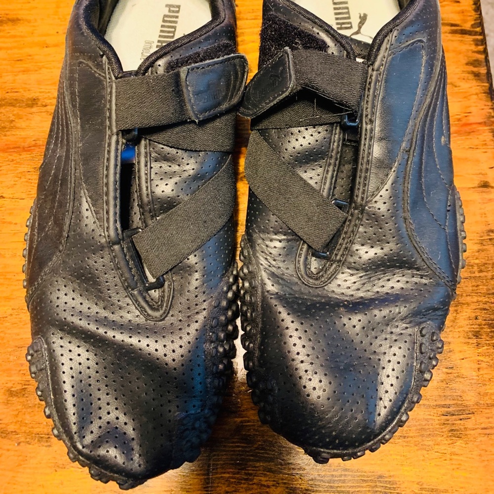 Black Pumas Mostro perforated leather shoes.